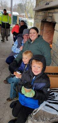 Warming by the fire during Catch-a-Coat