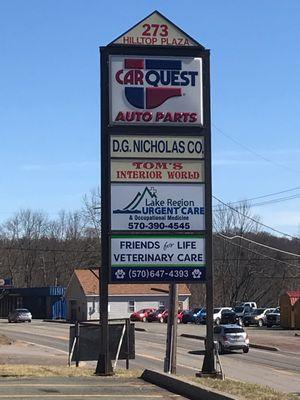 Sign is located at the plaza parking lot on Route 6 where Lake Region Urgent Care is located.