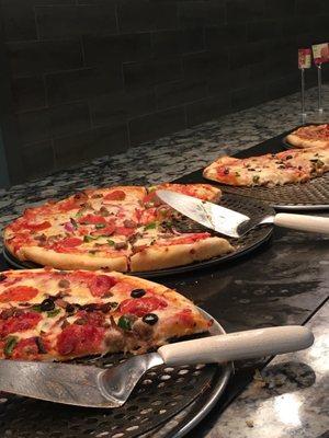 Pizzas on the buffet included the Brooklyn Bridge, The Godfather, and Buffalo Chicken...