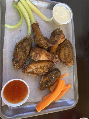 Jerk chicken with a side of blue cheese and sweet chili