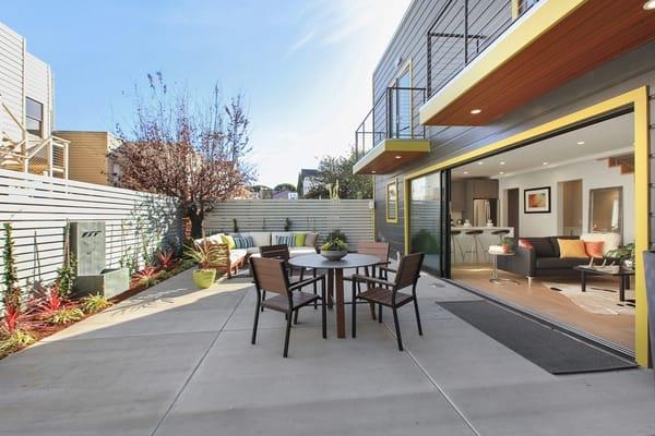 Modern San Francisco Inner Mission garden with horizontal fencing, concrete paving, and water feature.