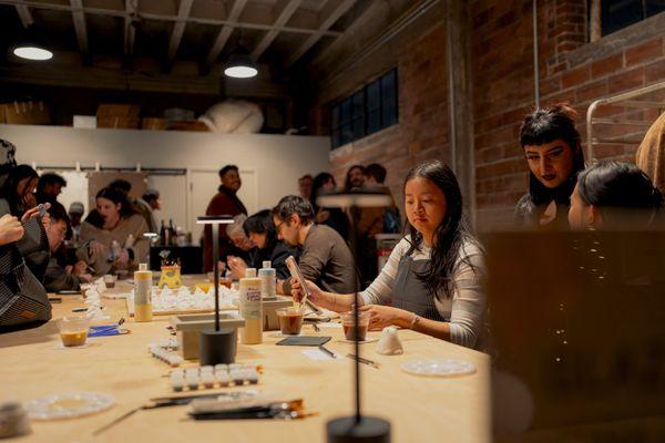 The community coming to glaze Christmas Ducks at the grand opening Workshop