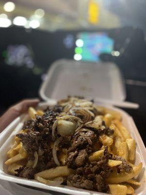 Carne asada fries with grilled onions