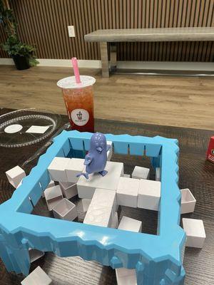 Penguin board game. Berrylicious Drink in the back.