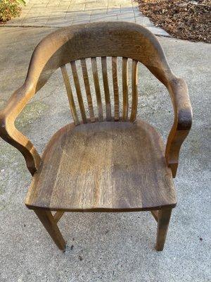 Oak Captain's chair restored by Szulman Woodworking in 2022.
