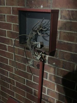 Fire and safety hazards all over exterior of buildings.