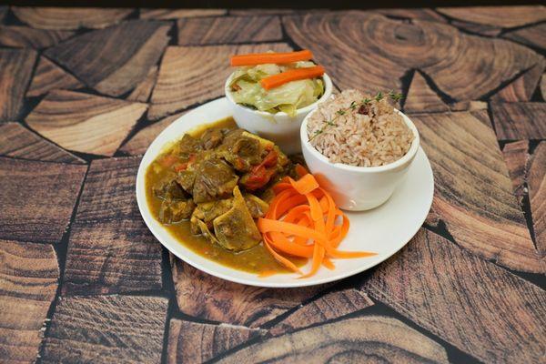 Curry Goat with rice & beans and cabbage