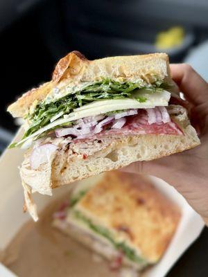 Turkey house-roasted turkey, toscano salami, pickled pepper remoulade, provolone, red onion, basil, arugula, oregano vinaigrette * 20