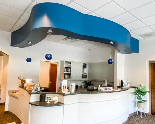 We do commercial painting, both interior and exterior as well. The blue accent wall gives this doctor's office a nice pop of color.