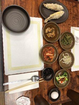 Banchan! Each packed tons of flavor in a different way. Including the fried fish was a nice extra.