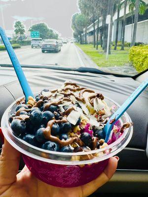 Delicious power açaí bowl with a generous peanut butter drizzle!