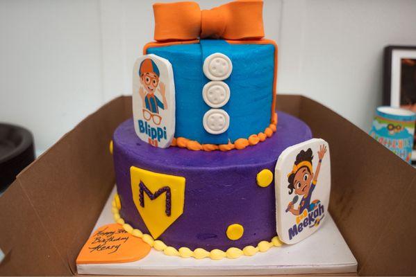3 year olds custom blippi cake, chocolate cake with vanilla filling, buttercream icing. We loved it!