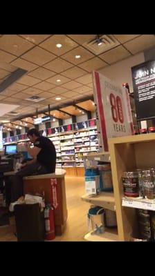 Check out this employee, sitting down smoking one of those vapor machines