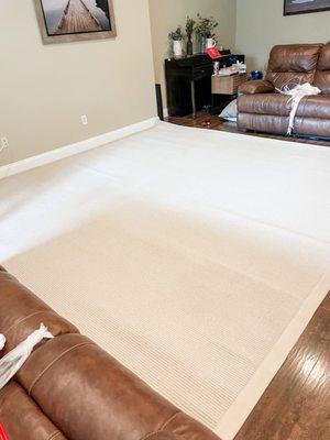 After picture- beautiful white! Natural lighting from outside gives it a nice look but is putting shadows on it from the couch and door.