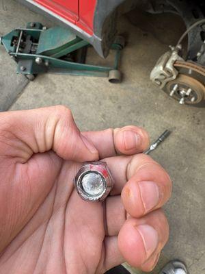 Broken thread inside lug nut too tight