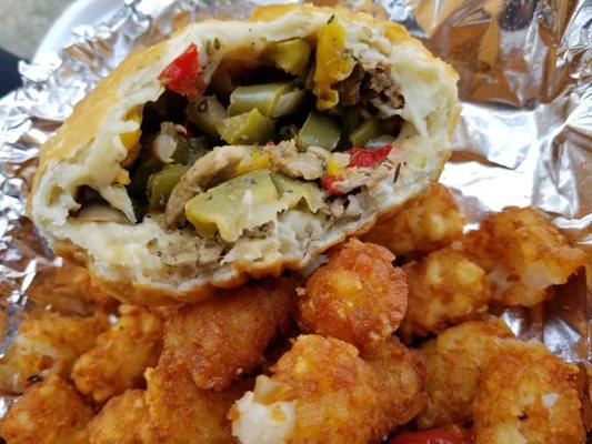 The Fresh Prince combo: a battered and deep fried cheese, mushroom, and pepper sandwich, with a side of tater tots and can of soda.