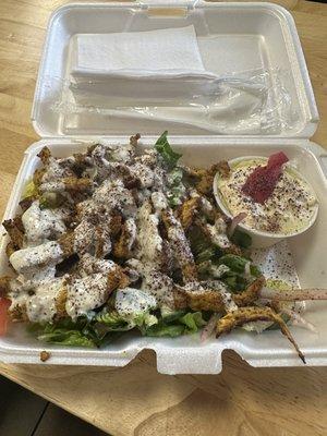 Chicken shawarma salad with hummus.