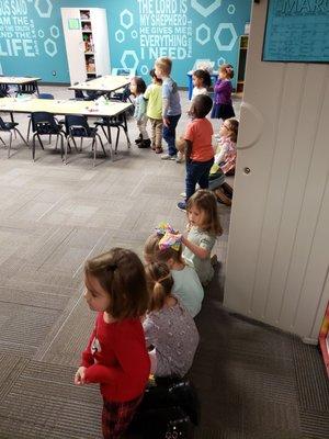 3 year old class just came from creative movement and are lining up for handwashing.