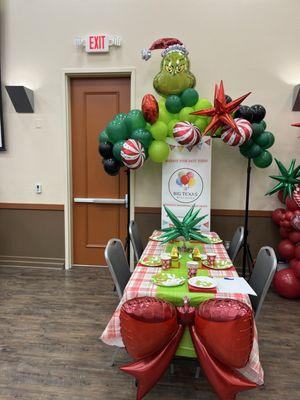 Christmas Grinch table setting with garland.