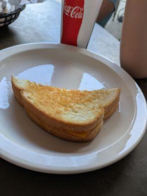 Half of a kiss grilled cheese