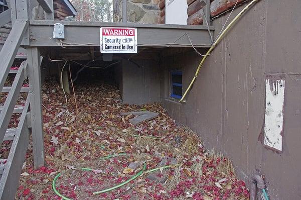 Electrical code violations under deck.