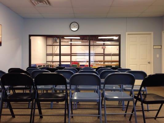 Parent waiting area with big windows for clear viewing into the gym area.