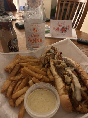 Jerk Chicken Phillycheese steak sandwich with fries and (cilantro lime dipping sauce, not available at HUNGRY AF)