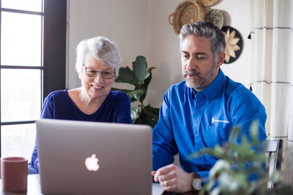 Our Tech Concierge working with an older adult member