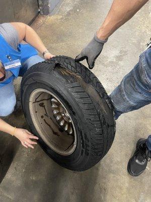 The exploded, almost 20 year old tire Ely's sold me. Note how the tread separated from the tire.