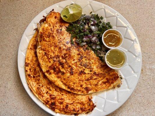 2 Quesabirrias made with flour tortillas.