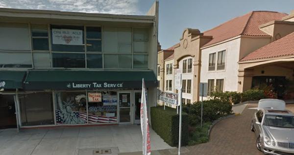 Located right between Liberty Tax Service and the Hilton Hotel. Small door in between locations, right on the second floor.