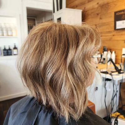 A Line bob, dark blonde with a shadow root.