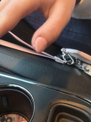 Notice the hunk of polish on her skin by her thumbnail.