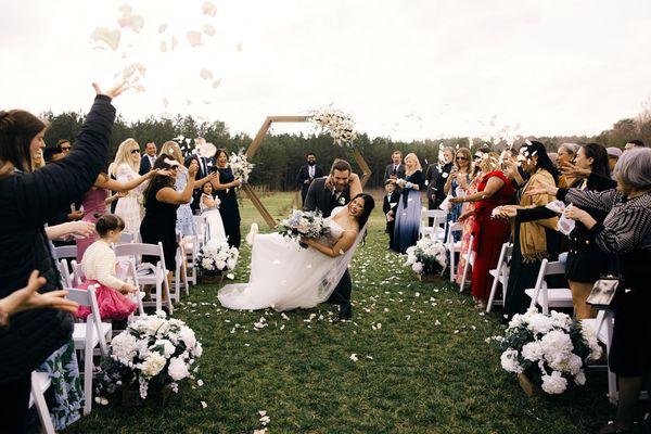 Bride celebrating in J. Major's Bridal Boutique Wedding Dress in Charlotte.
