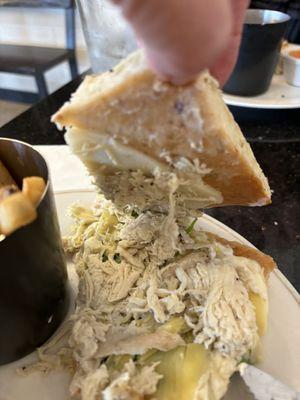 Shredded cold chicken and unmelted cheese and just a few leaves of the artichoke.