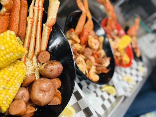 Seafood Boils with your choice of Protein served with sausage, corn and red potatoes. Pictured is a 1lb Snow Crab Boil.