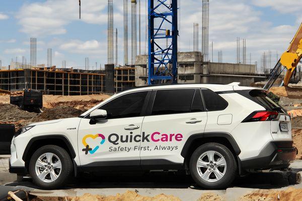 QuickCare mobile unit providing on-site health services at a construction job site. Fast, reliable healthcare for workers in action.