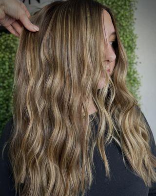 Elevate your style with dimensional highlights and customized cuts designed to complement your unique features and lifestyle.