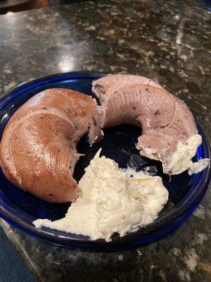 Blueberry bagel with pineapple cream cheese spread.