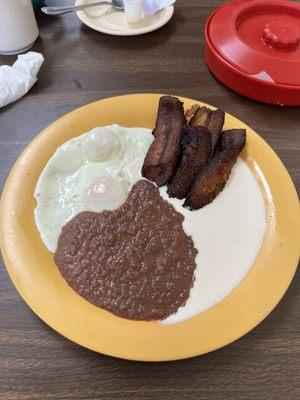 Friend plantains, beans, crema, juevos with tortillas.