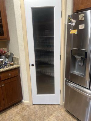 New pantry door with beaded glass waiting for paint & hardware