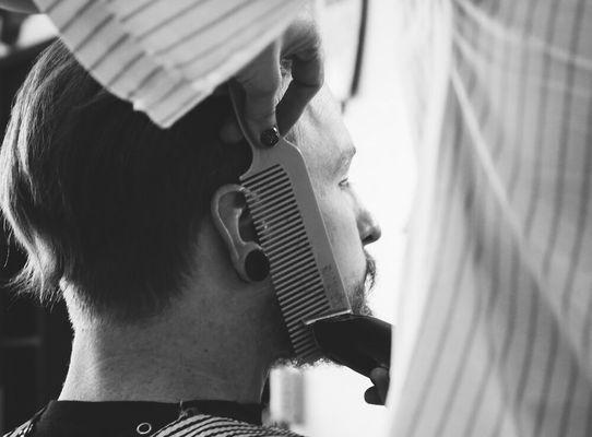 Traditional barbering methods. None of those plastic guards that fall off & us asking you what number you want.