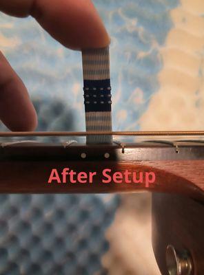 This is the string height after setup, where it should be at 2mm