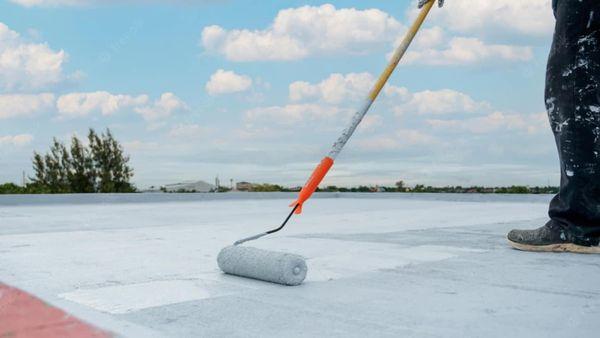 Roof coating extends roof lifespan and improves energy efficiency through sun reflection. (stock photo)