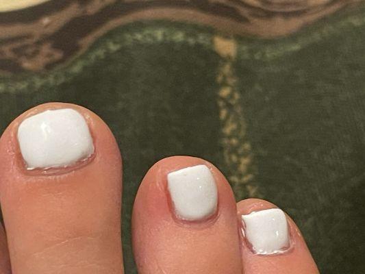 Uneven and messy polish.