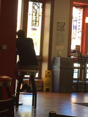 Employee (or manager) on phone while only one working.