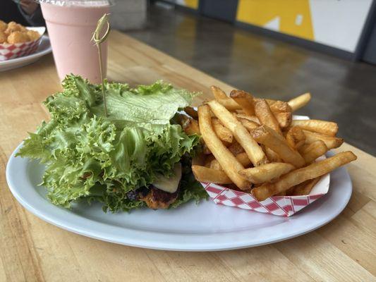 Chicken Masala sandwich with lettuce bun and fries
