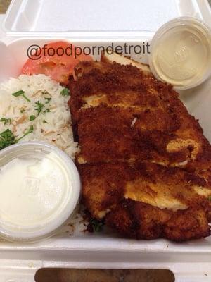 Chicken cream chops with rice, hummus and garlic paste.