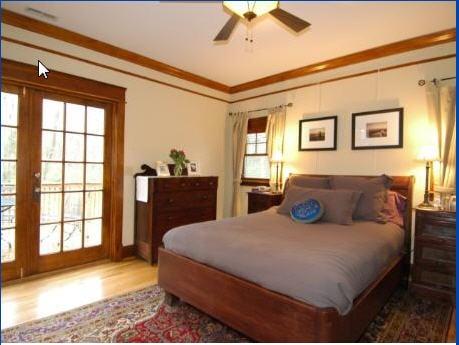 Addition bedroom that we built with heartpine floors and reclaimed trim