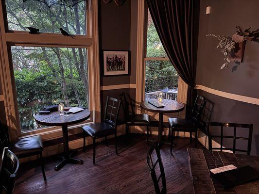 Cozy tables by magnificent windows